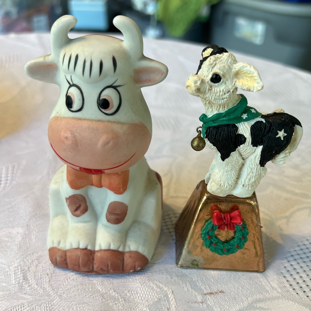 Vintage Ceramic cow bell and cow bell on top of copper bell with wreath